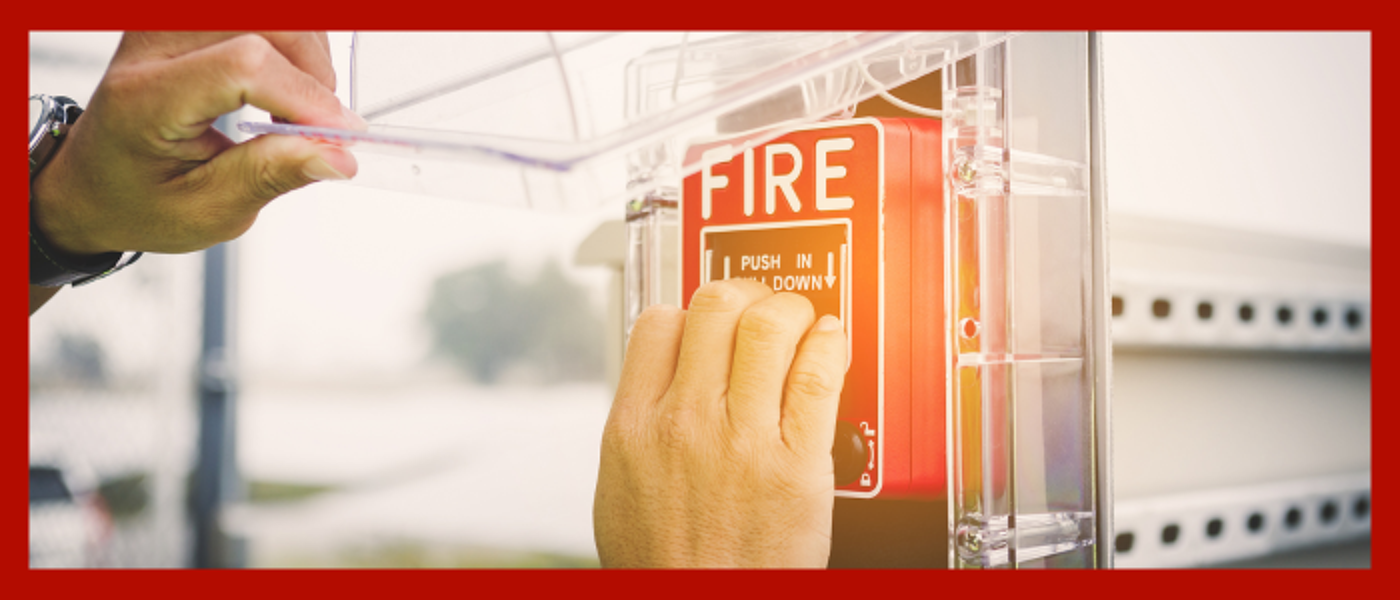 For decorative purposes only - hand pulling the lever of a fire alarm device