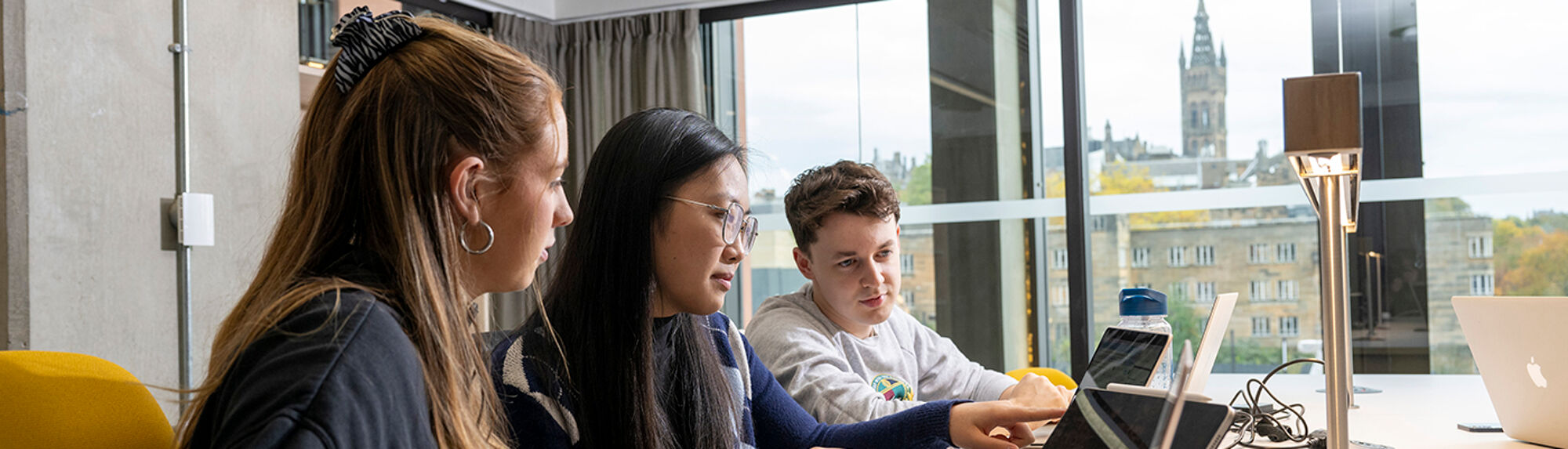 Students study in the Adam Smith Business School & Postgraduate Taught Hub